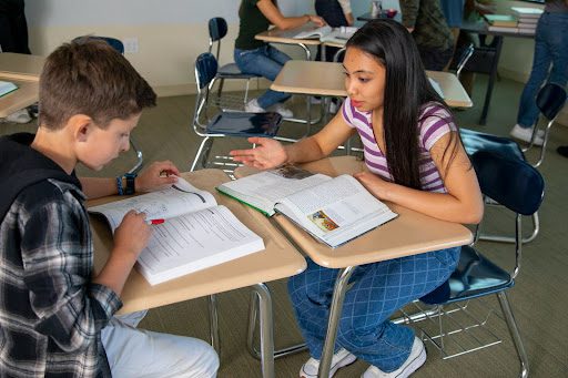 High school students practicing reading and writing